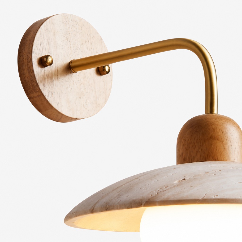 Discra wall sconce material detail with wood backplate and brass arm