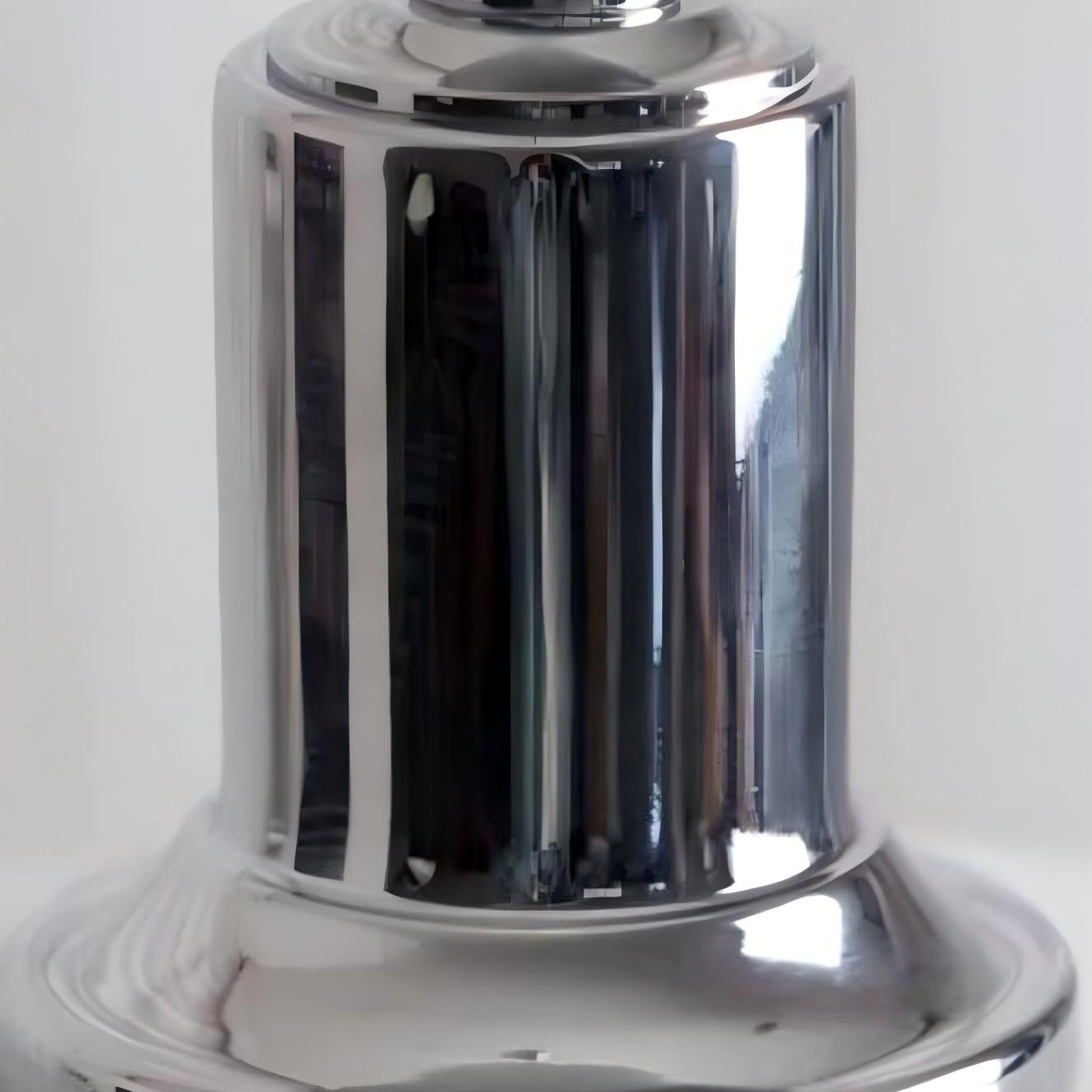 Close-up of polished metal pendant lamp stem