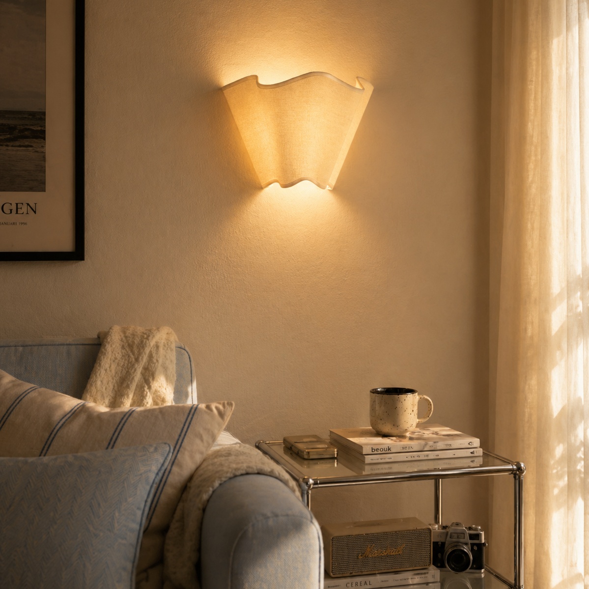 Oslan wall sconce glowing beside a living room chair