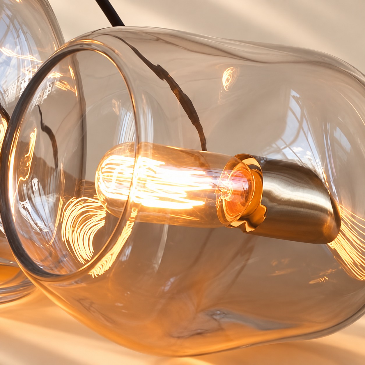 Hand-Blown Glass Globe Pendant with clear glass and a rounded shade