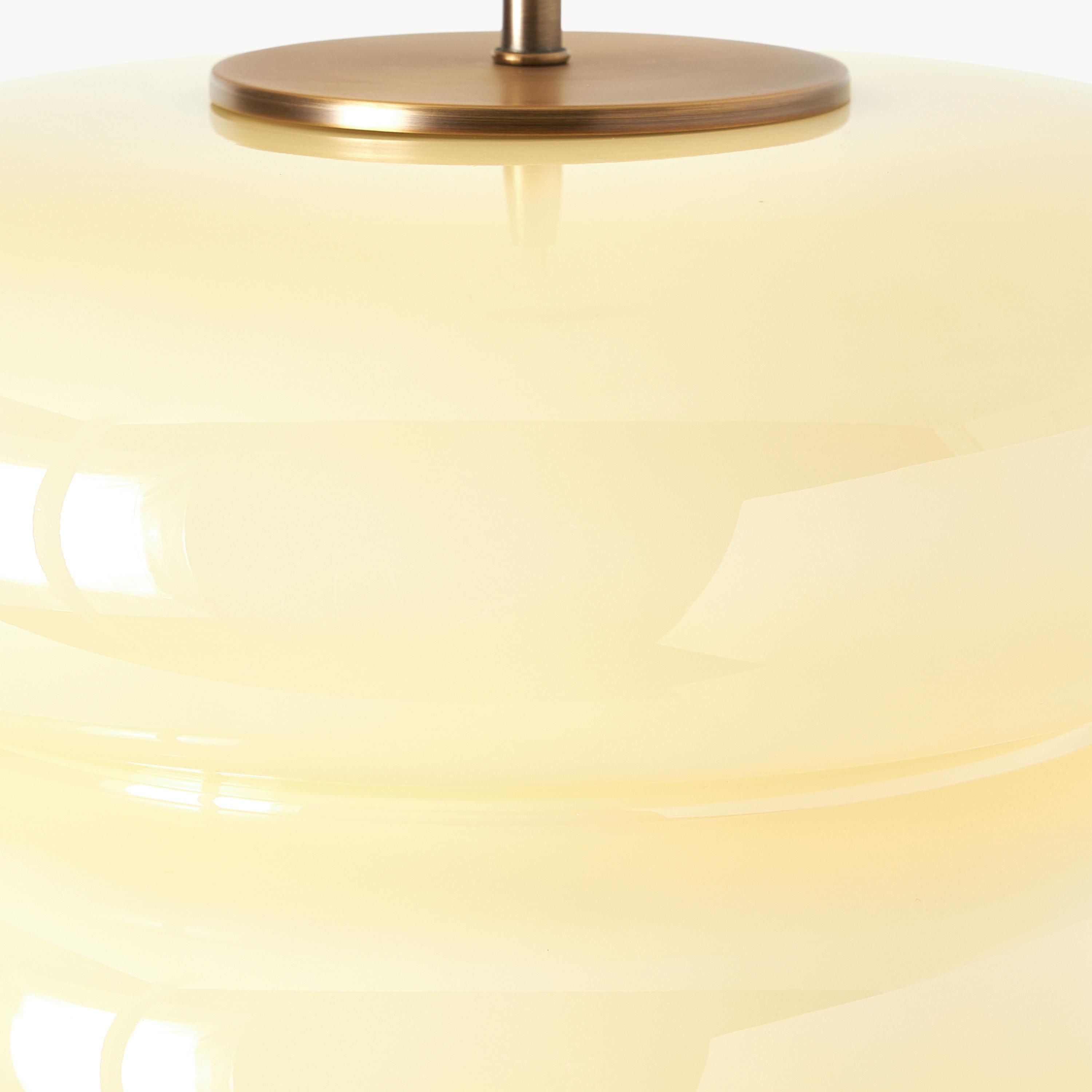 Close-up of opal glass and brass canopy
