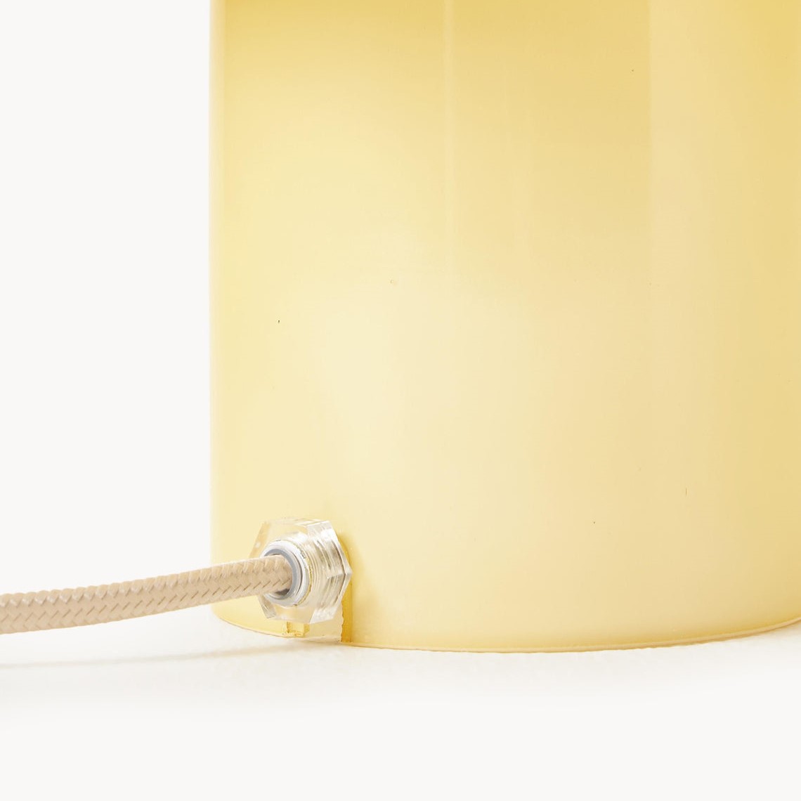 Close-up of lamp cable and opal glass base