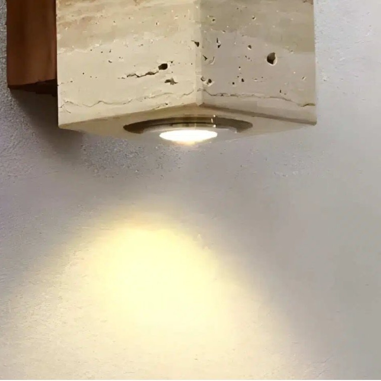 Torvella wall sconce detail with warm light