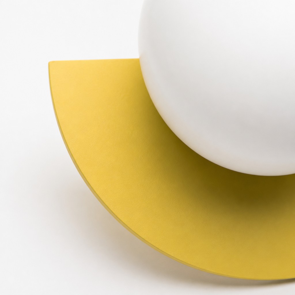Close view of the yellow Orbion wall sconce