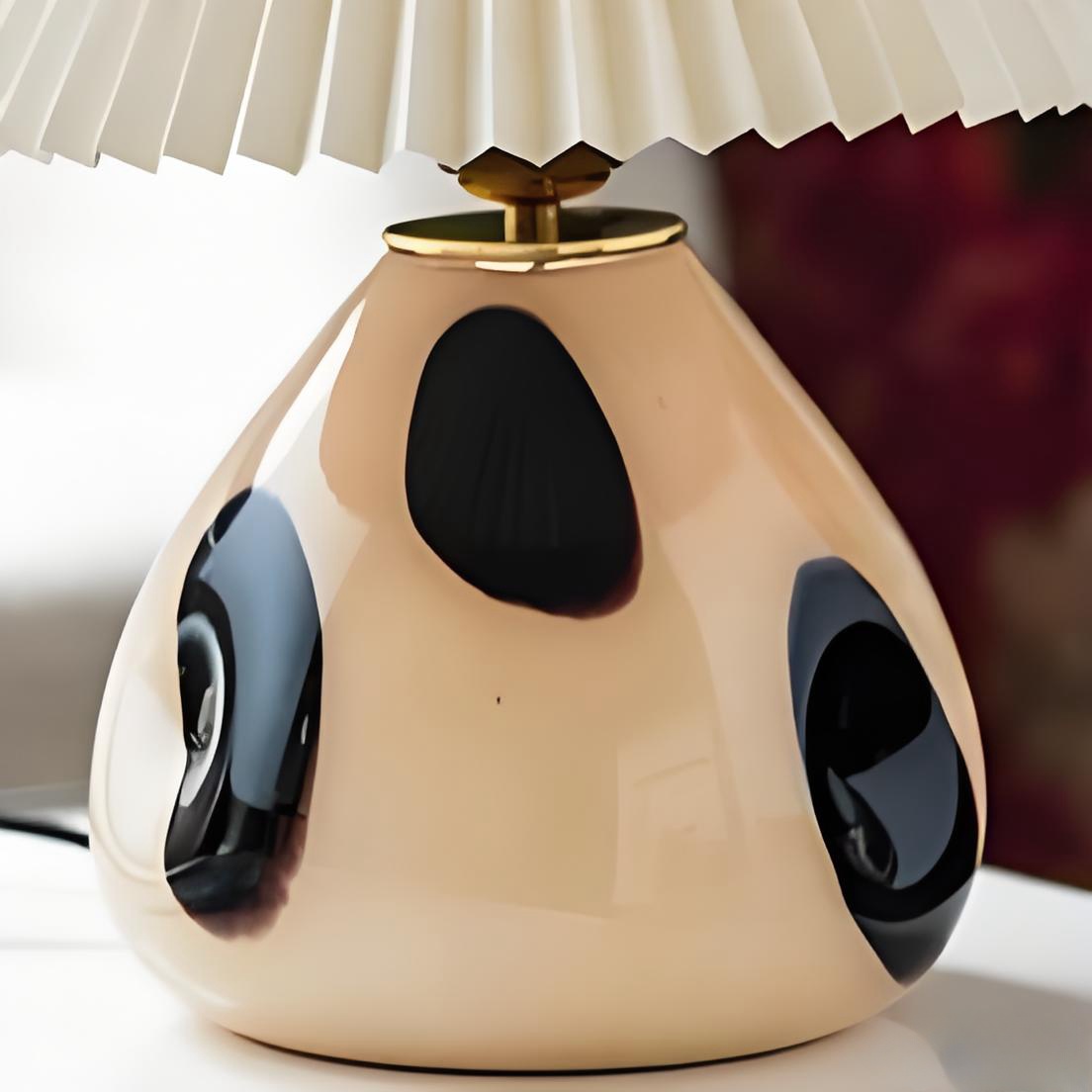Close detail of the Undara lamp ceramic and glass base under the pleated shade