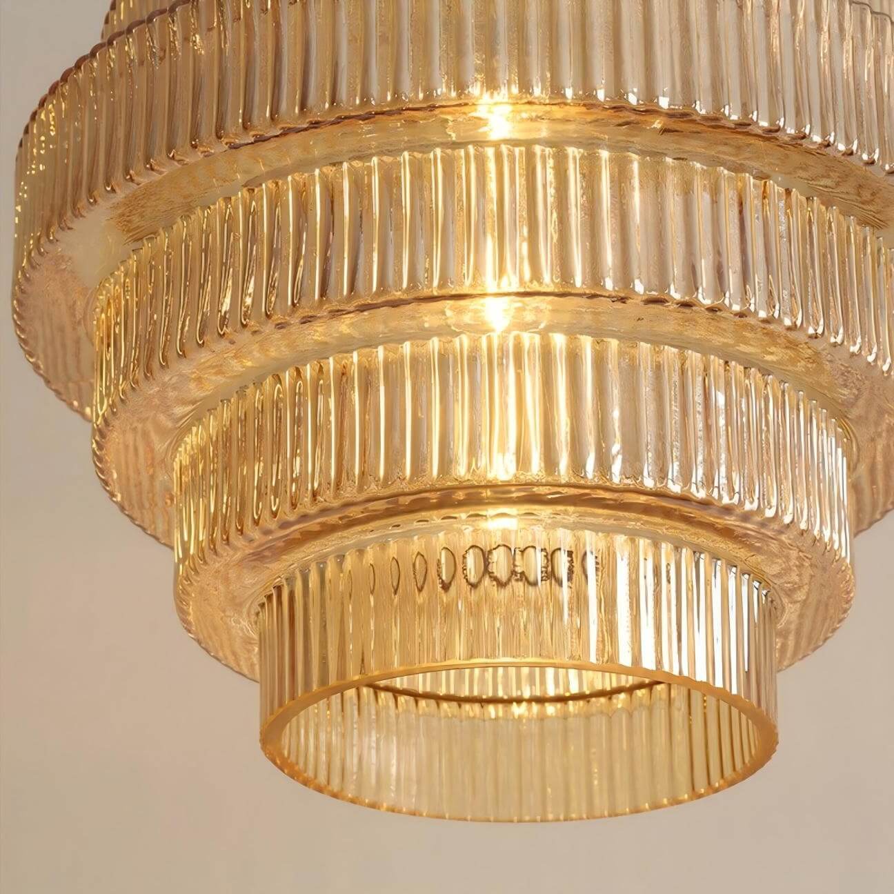 Warm illuminated Ribella glass pendant detail