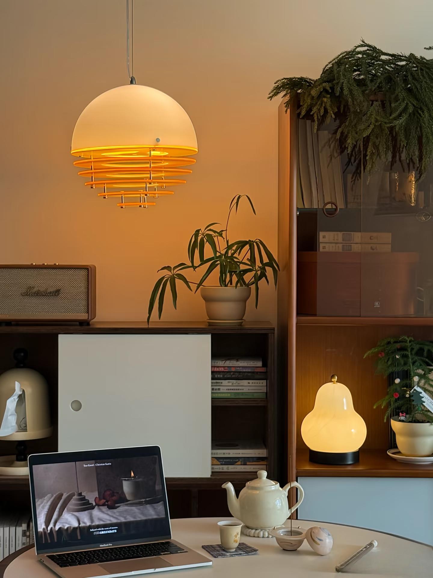 Sunset pendant light above a desk and shelving scene