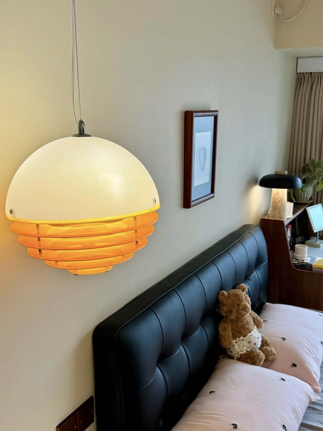 Sunset pendant light installed above a bedroom