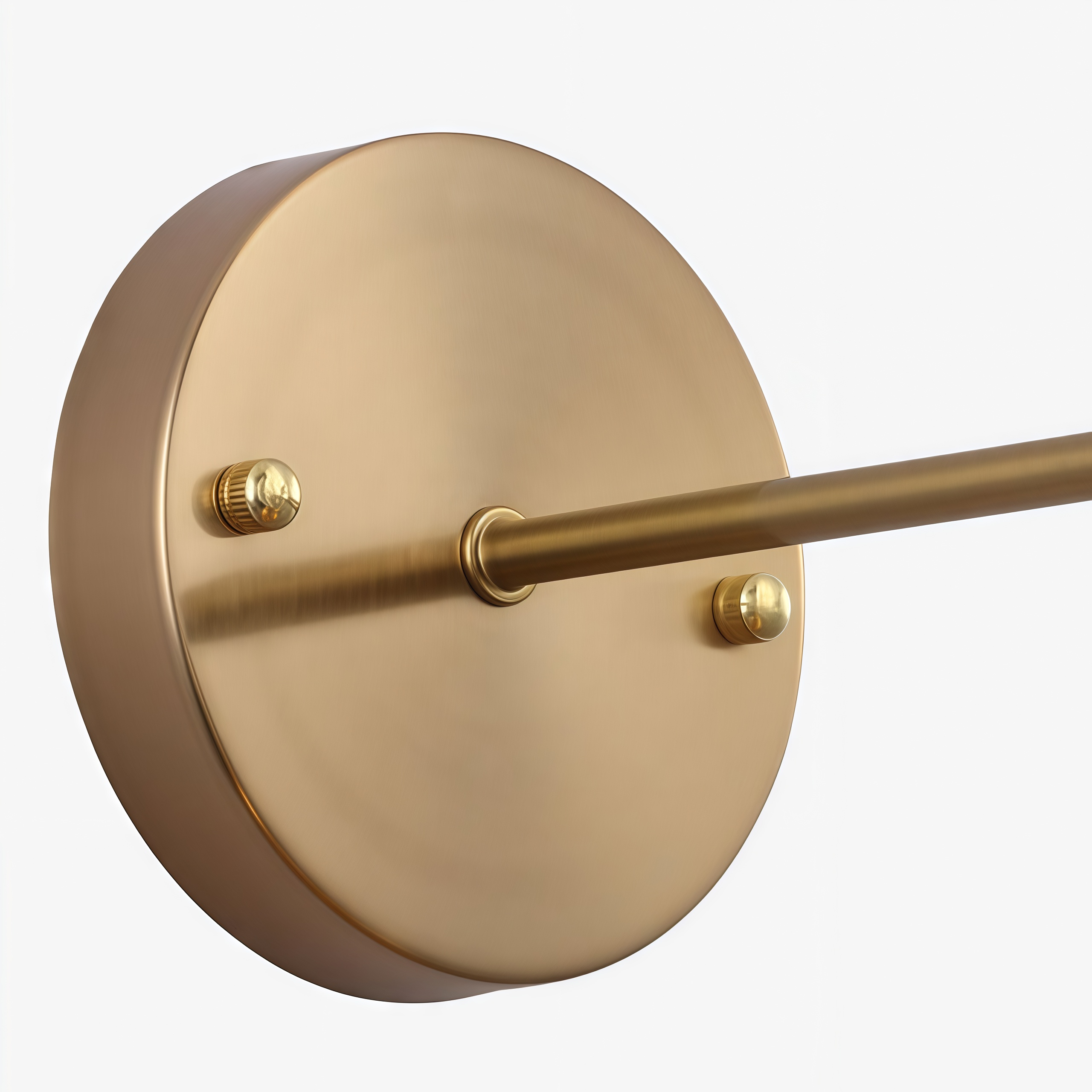 Close-up of brass wall plate and arm