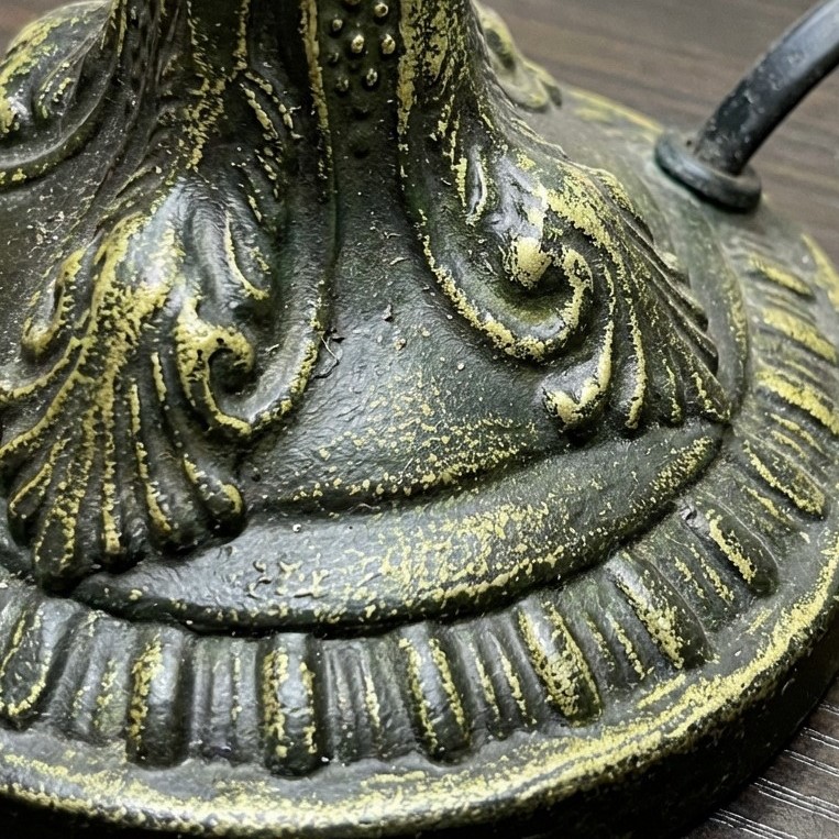 Close-up of textured metal lamp base