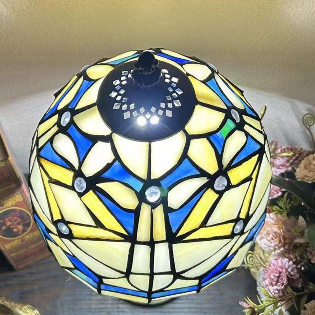 Top view of Tiffany glass dome shade illuminated