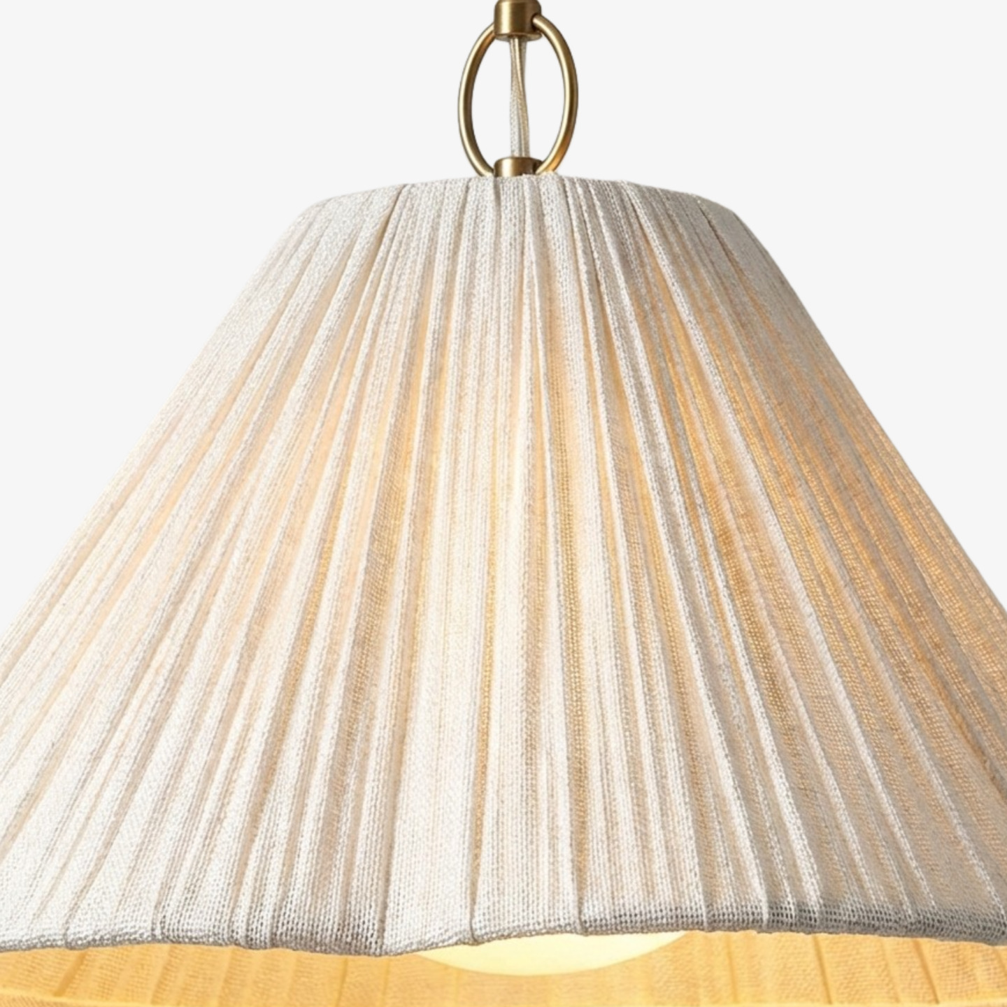 Warm glow through the scalloped pleated linen shade