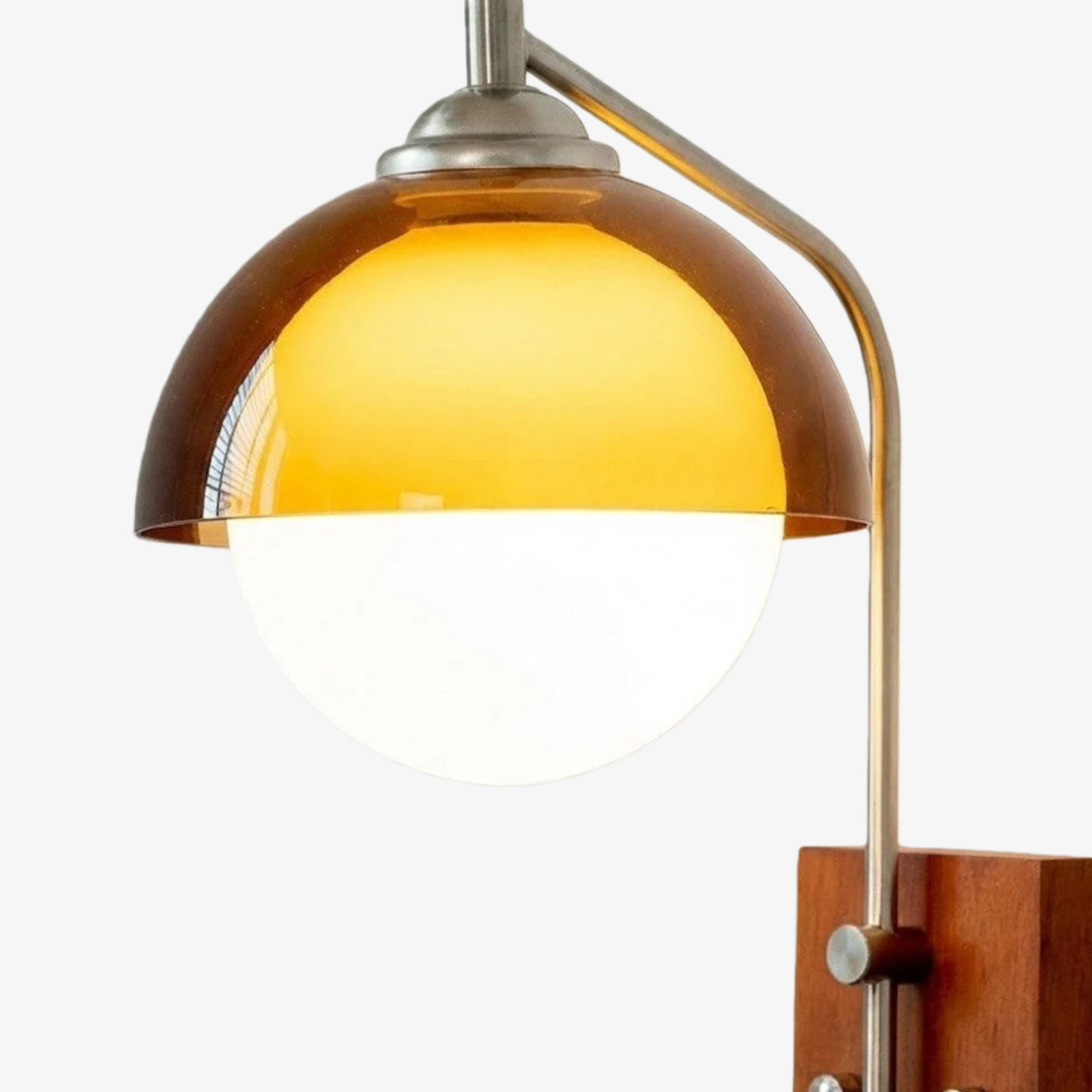 Close-up of orange acrylic shade and wall lamp frame