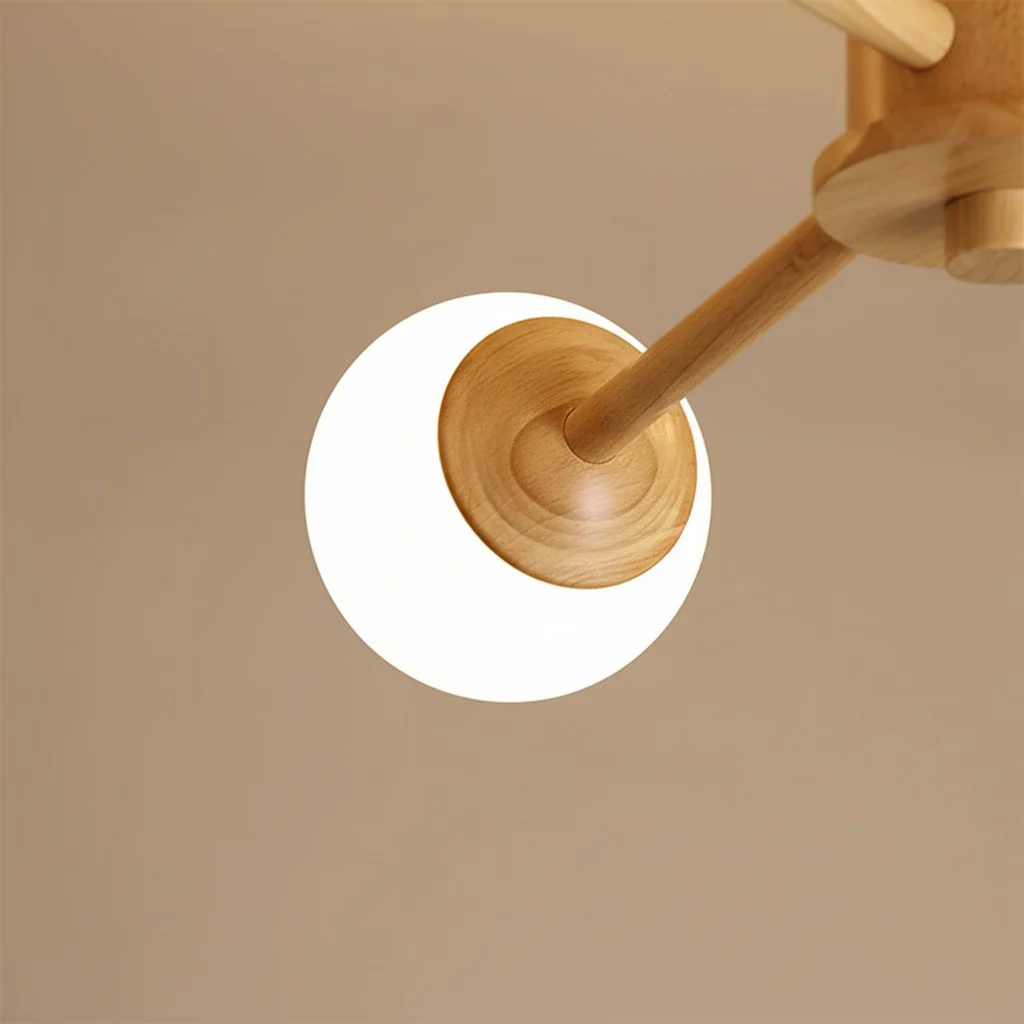 Close-up of Orrise globe shade and wood arm