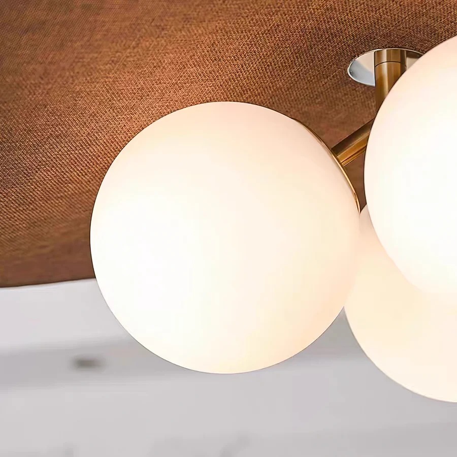 Close detail of Orrise glowing glass globe and petal shade