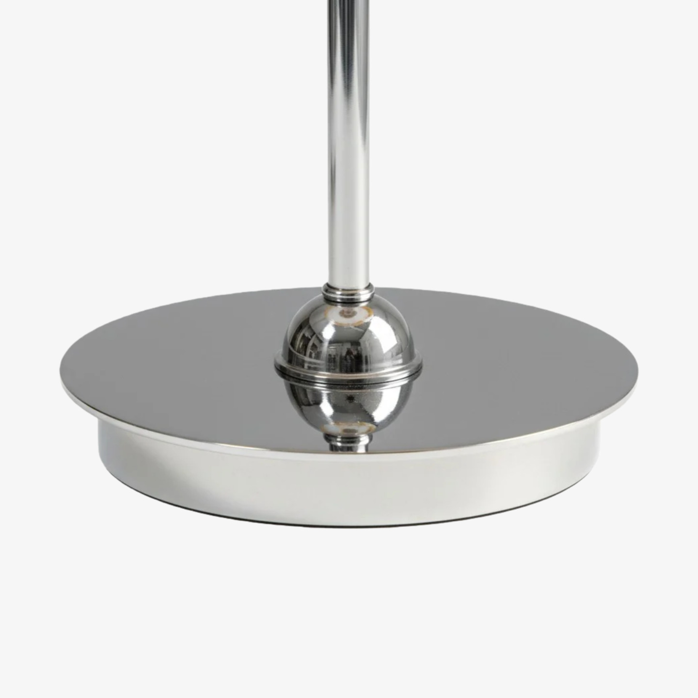 Polished silver base detail of the table lamp