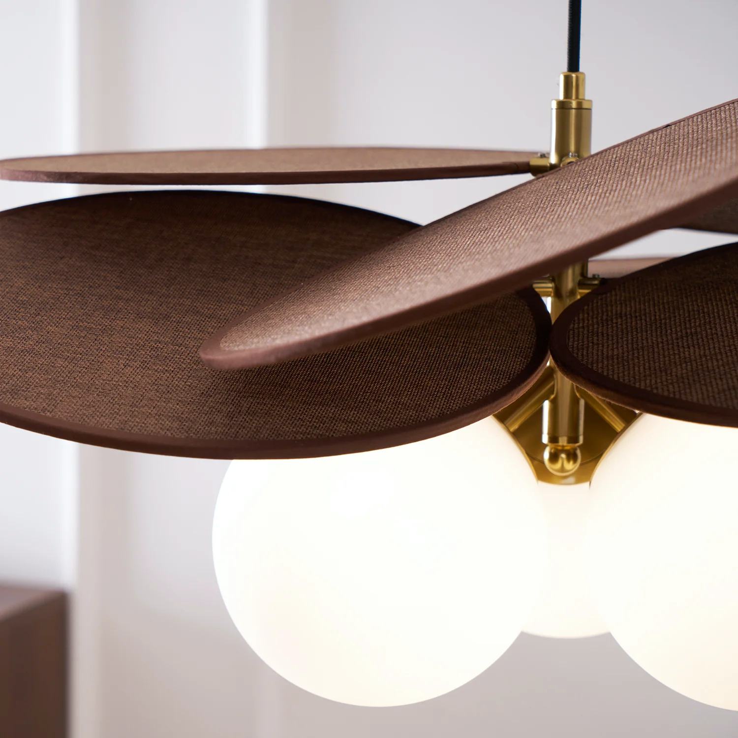 Close-up of Orrise pendant layered panels and glass globe