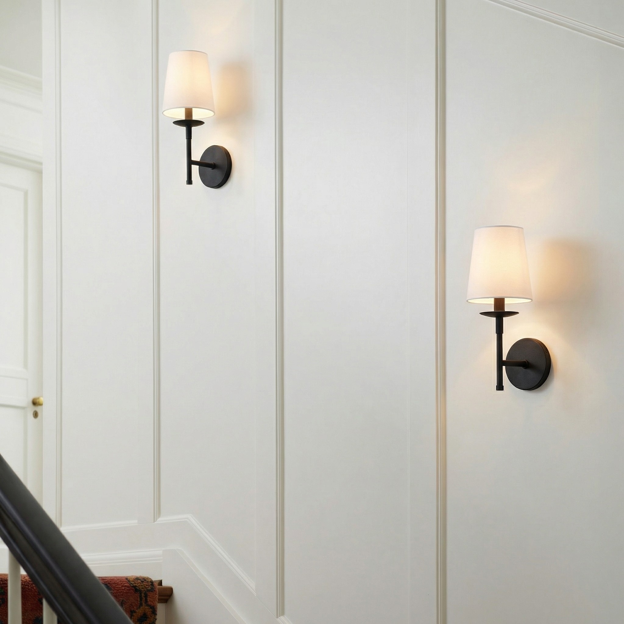 Rowan wall sconce mounted in a hallway