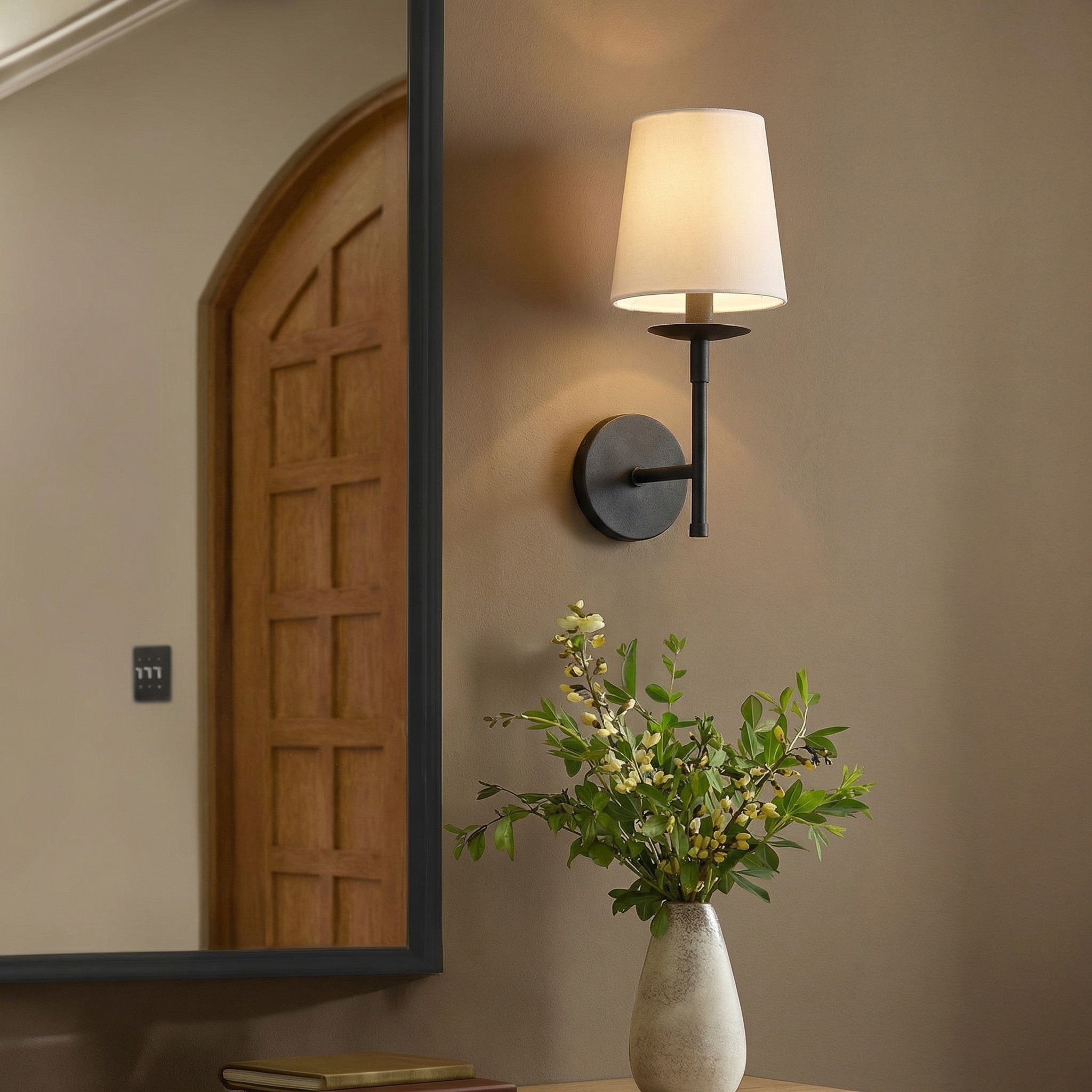 Rowan wall sconce with a warm linen shade