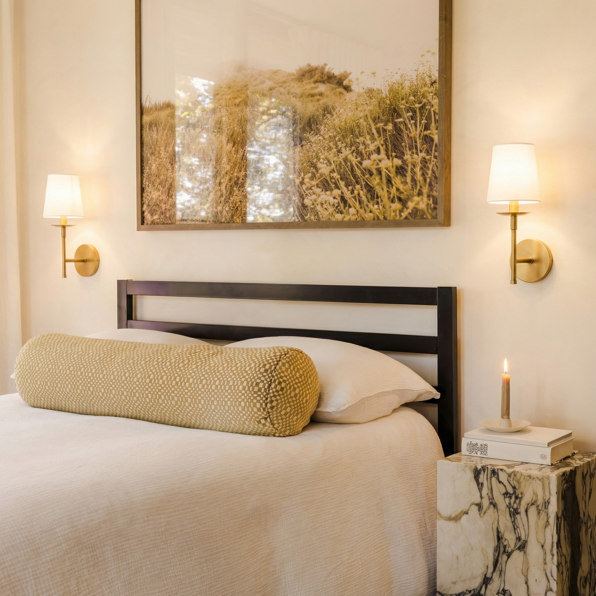 Rowan wall sconces styled beside a bed