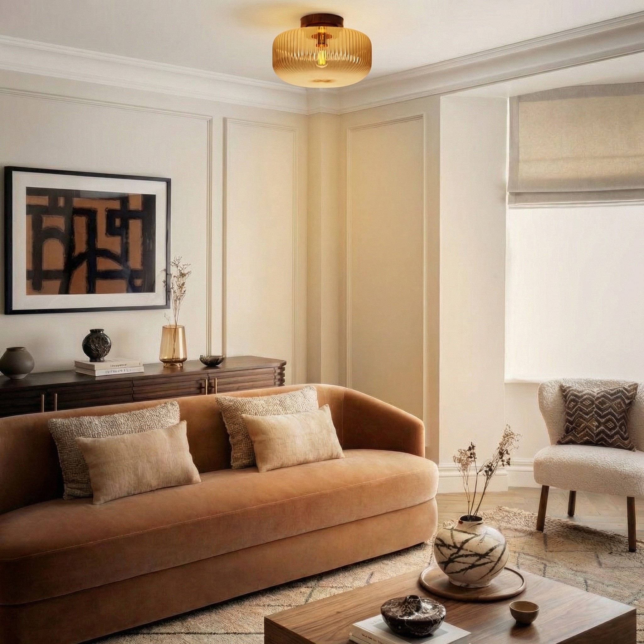 Navello amber glass ceiling light above a seating area
