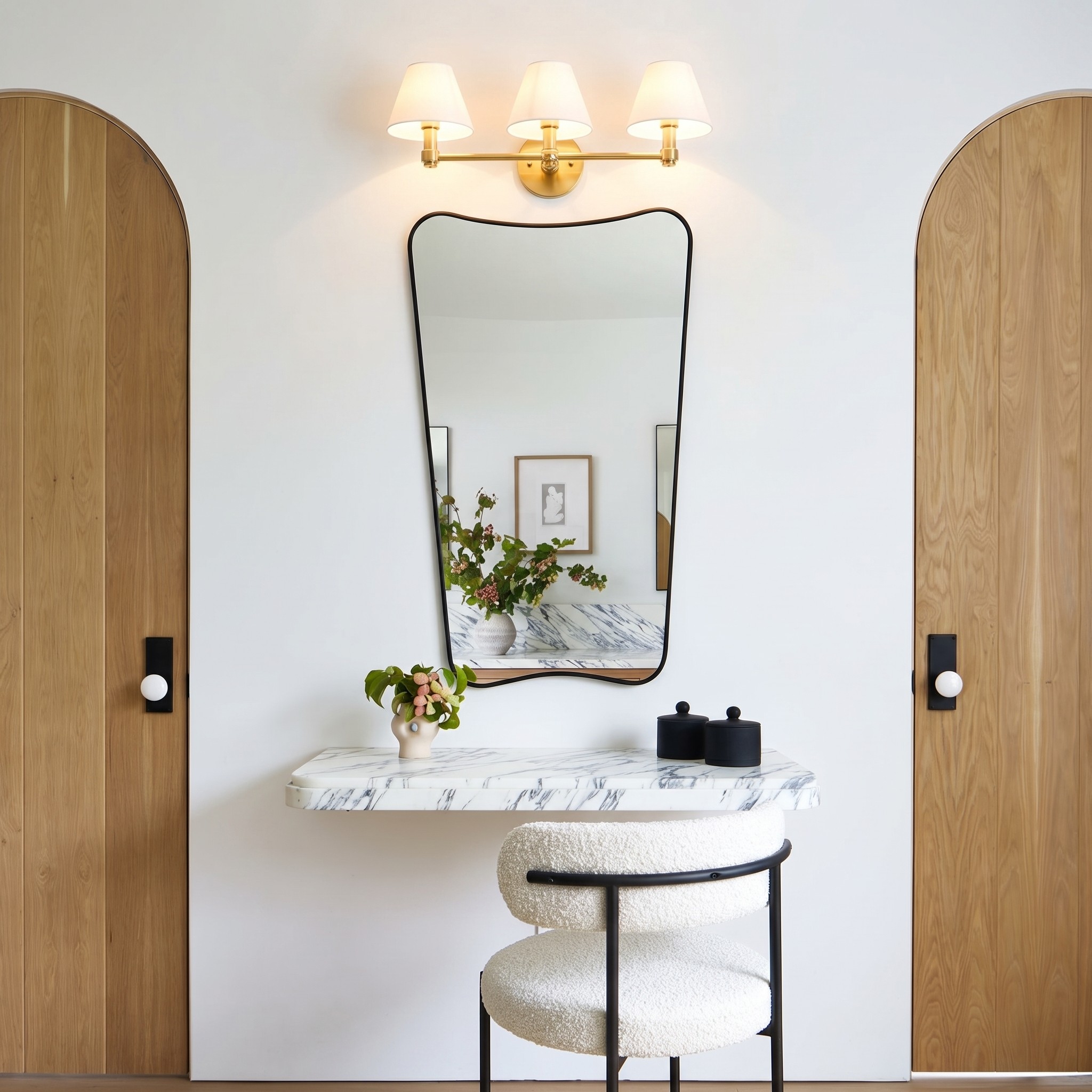 Roven wall sconce styled beside a bathroom mirror
