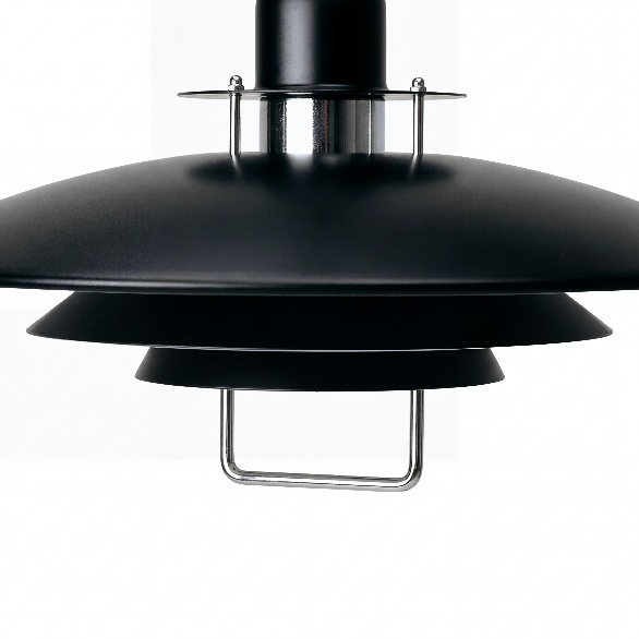 Close-up detail of the black concentric disc pendant shade