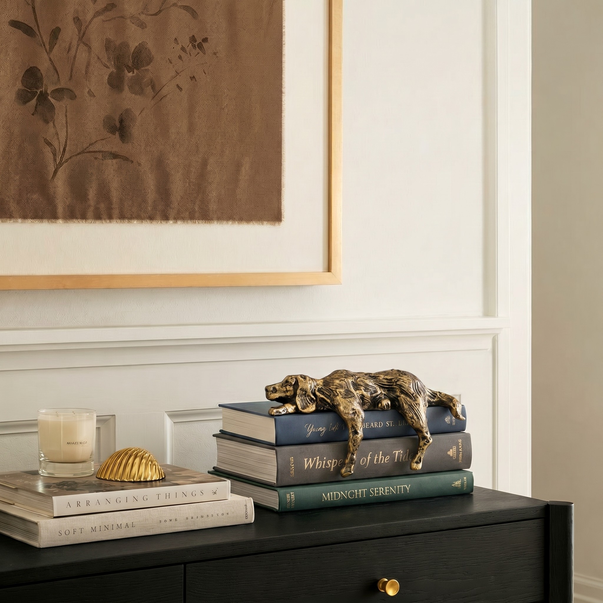 Floxo lazy dog figurine styled on stacked books in a home interior
