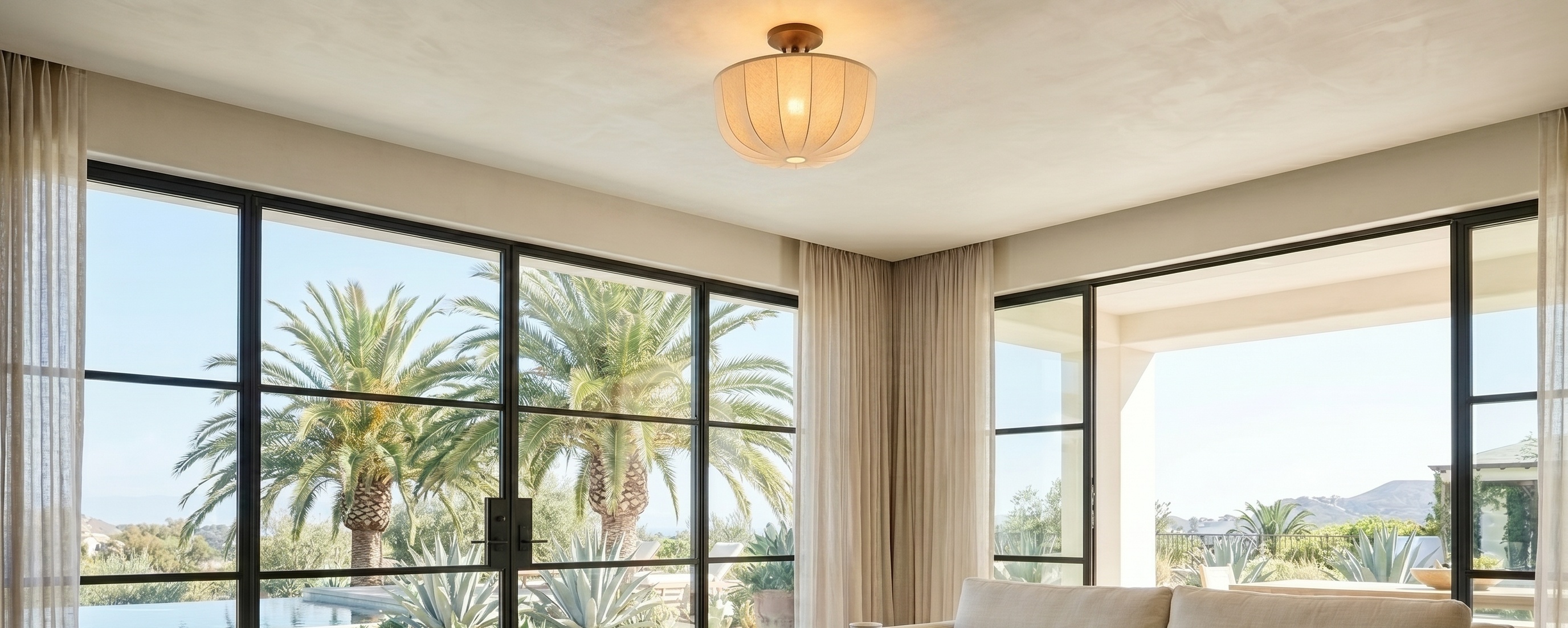 Loomis linen flush mount ceiling lamp styled in a bright living space