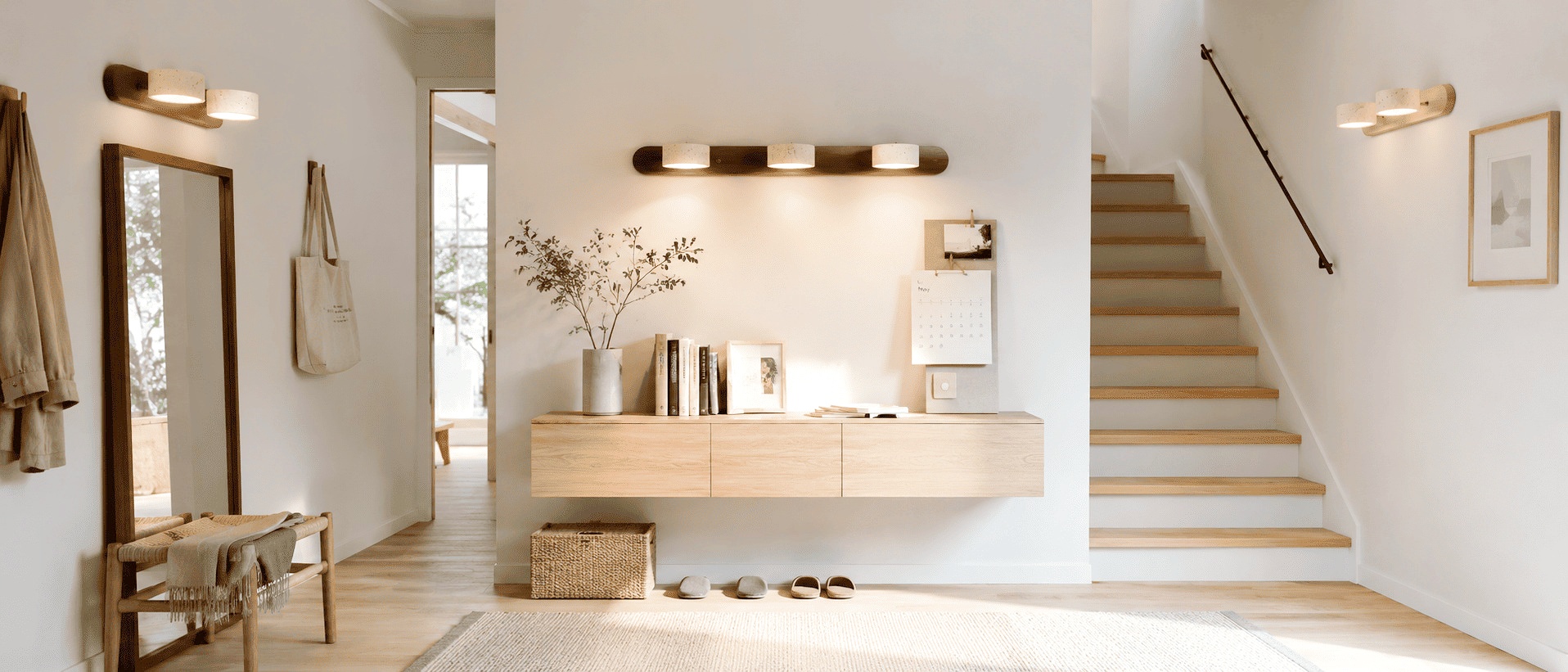 Travira sconces styled across an entryway and staircase