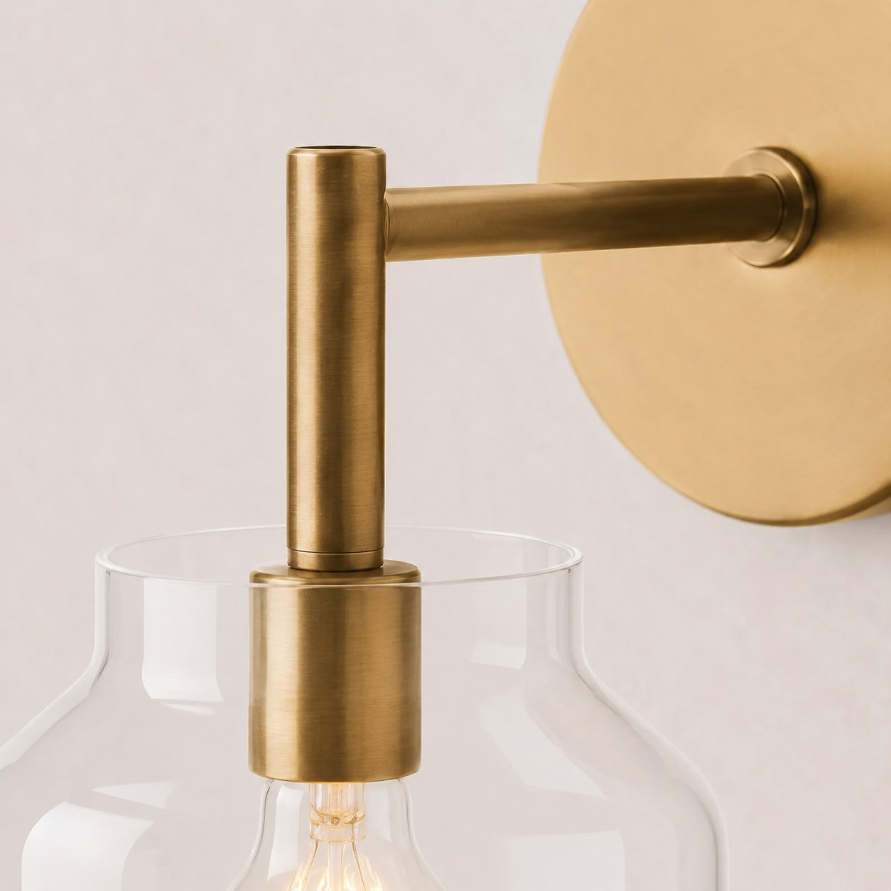 Close detail of the Hanton brass arm and glass shade