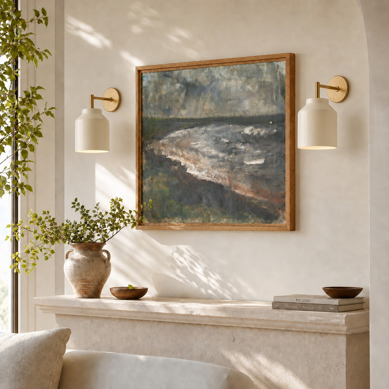 Hanton brass sconce lighting a framed wall scene