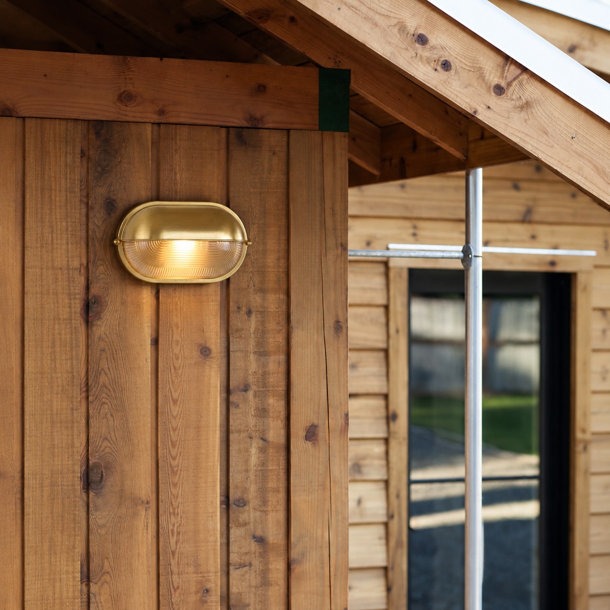 Docka retro wall light mounted on a timber wall