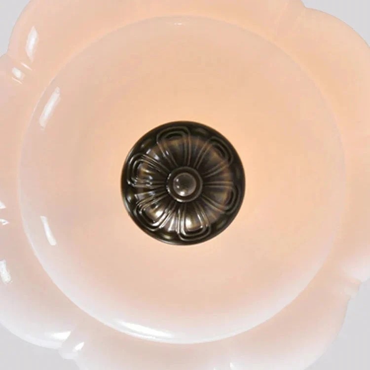 Pink scalloped glass shade detail from below