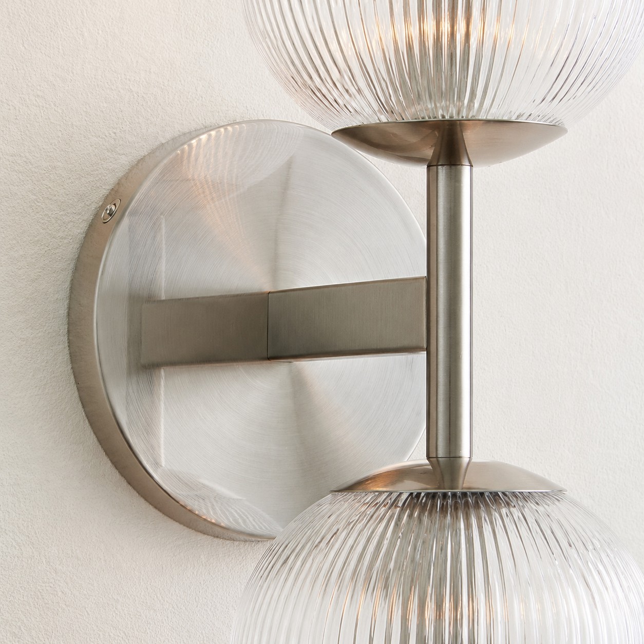 Brushed gold frame and clear glass pendant detail