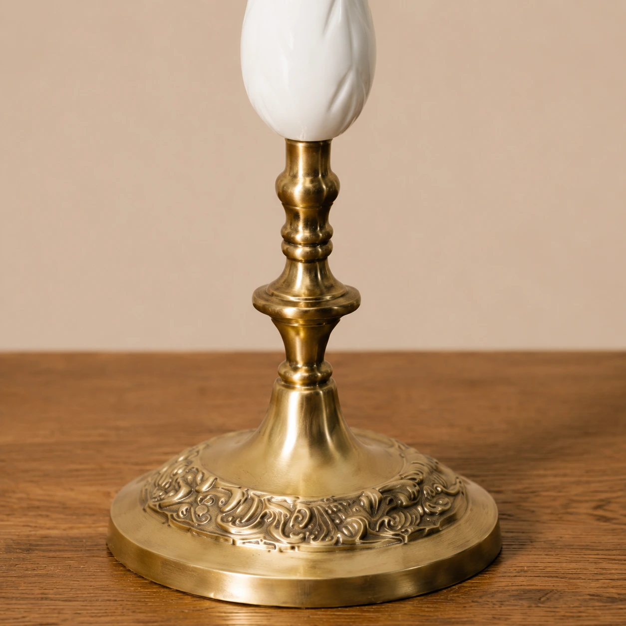 Close detail of Aura candlestick base and ornamental metalwork