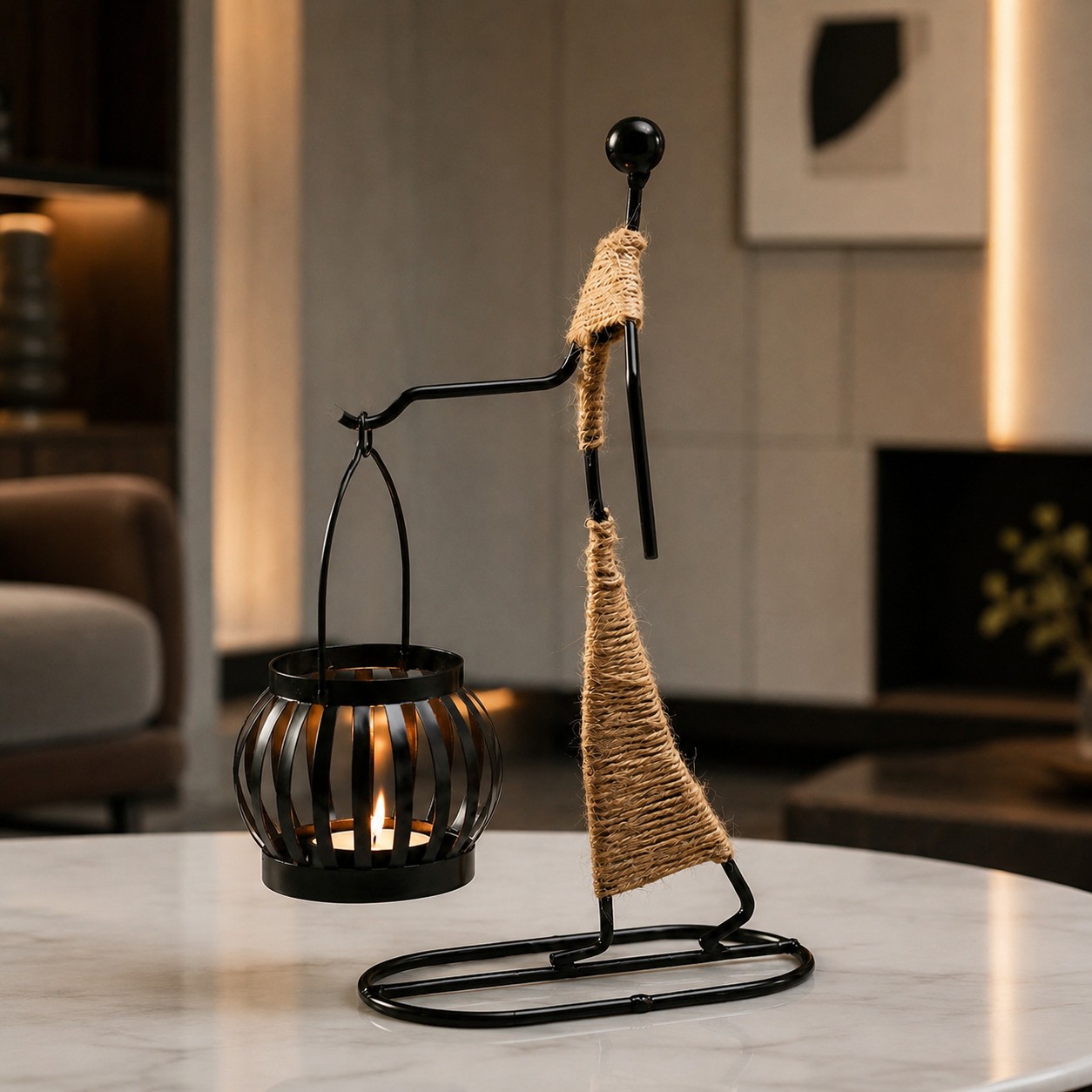 Aura Handheld Lantern black metal tealight candle holder on a warm tabletop