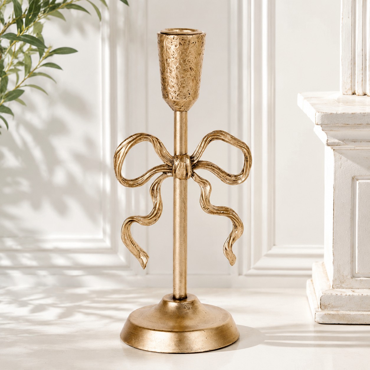 Aura gold bow candlestick holder with antique iron finish