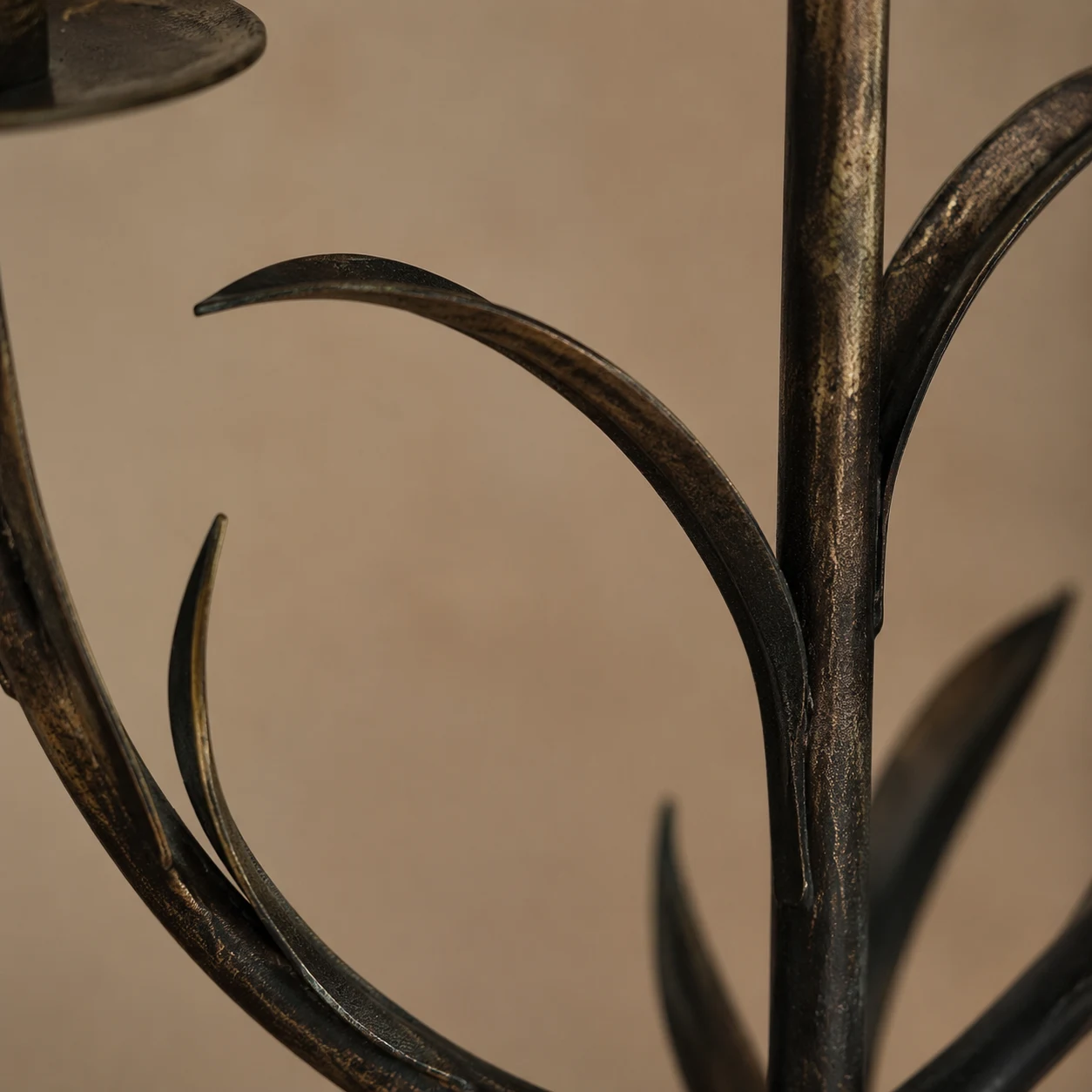 Close detail of antique copper leaf and branch on Aura candlestick