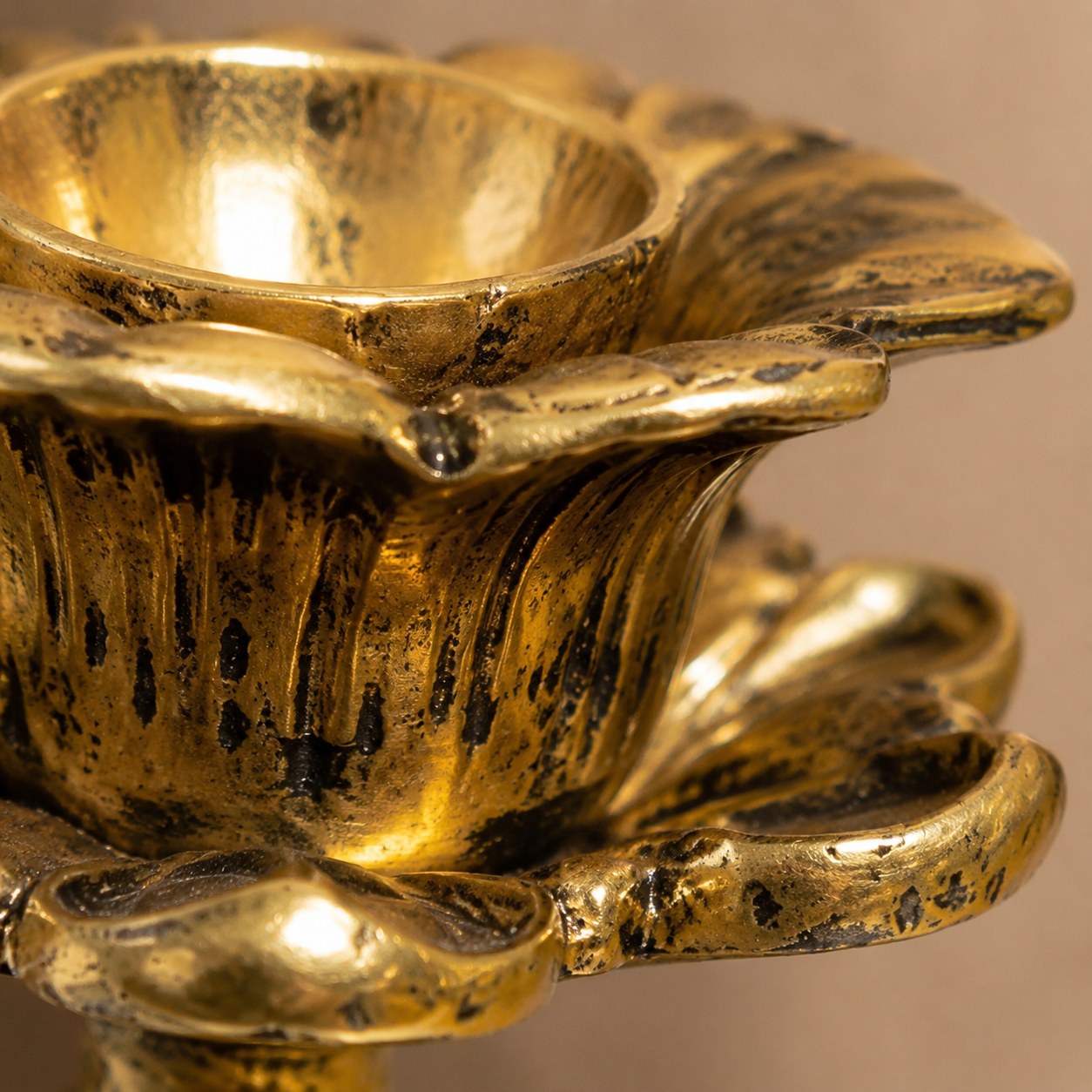 Close detail of Aura candlestick scalloped copper rim and aged patina