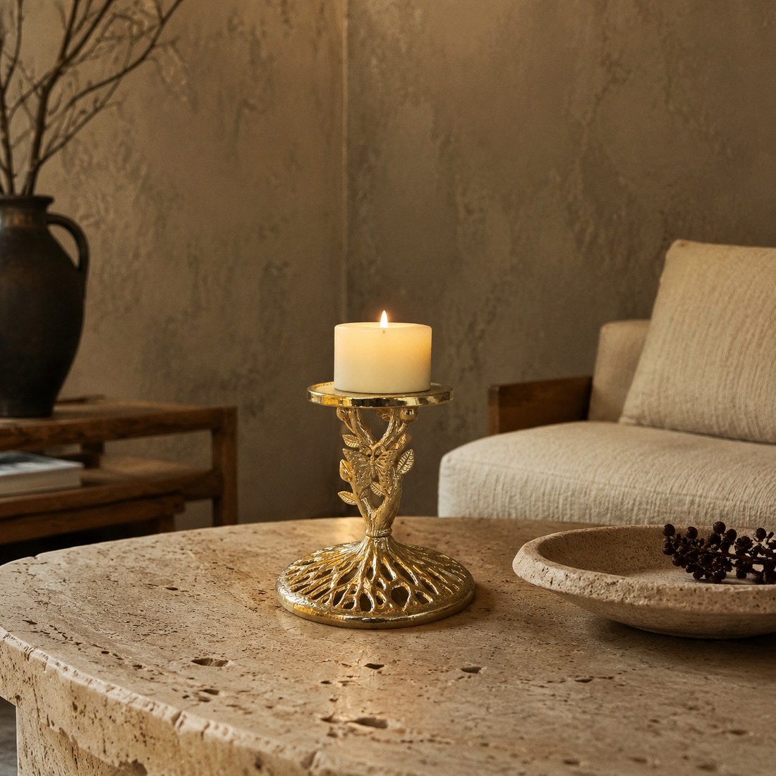 Aura candlestick holding a pillar candle in a warm interior