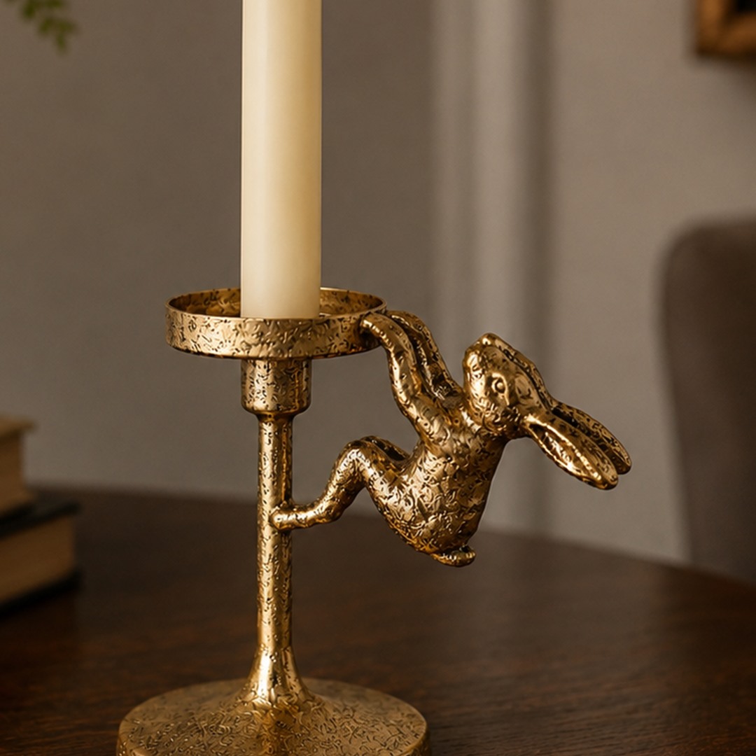 Close view of hammered gold metal texture on the Aura candlestick