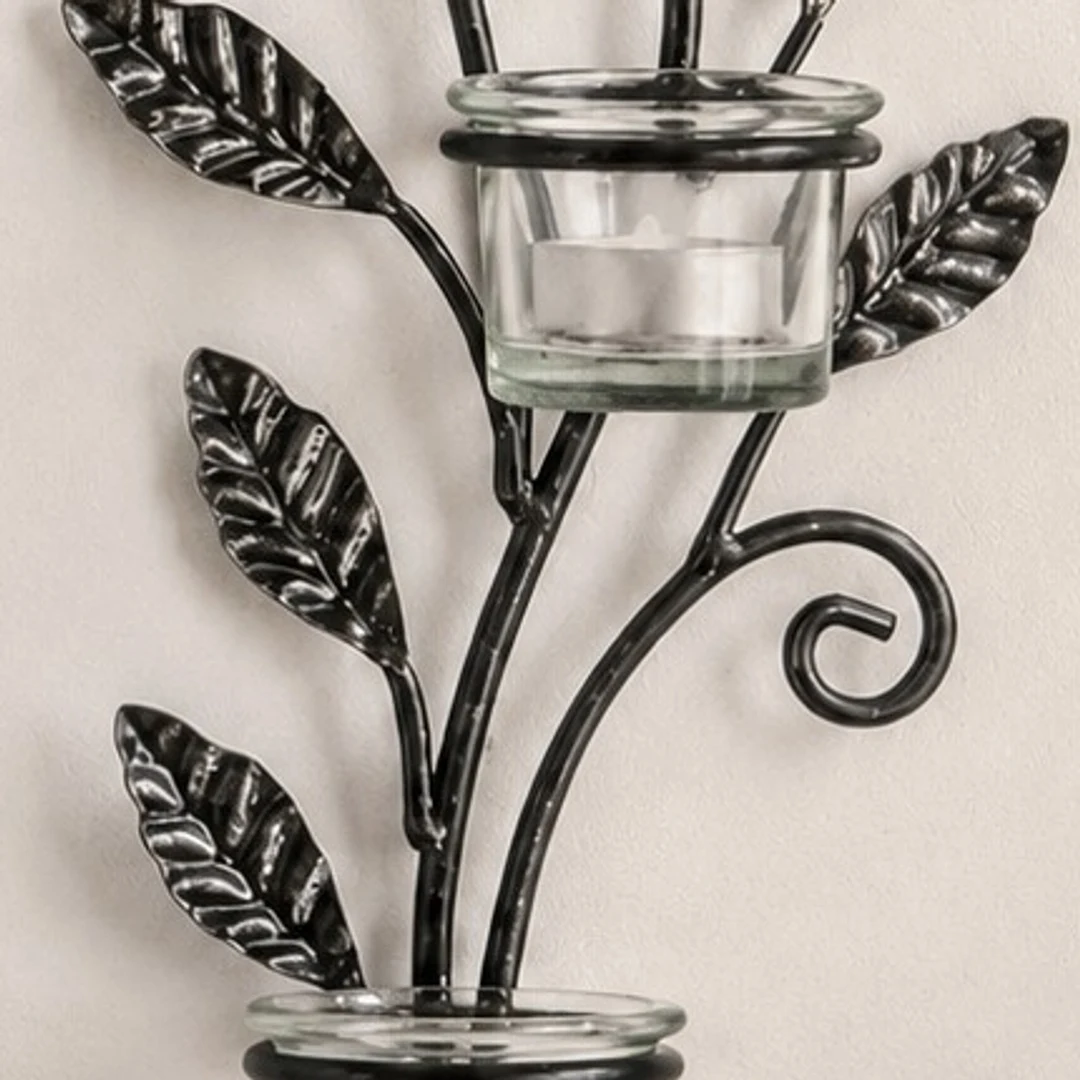 Close detail of textured black iron leaves on Aura candlestick