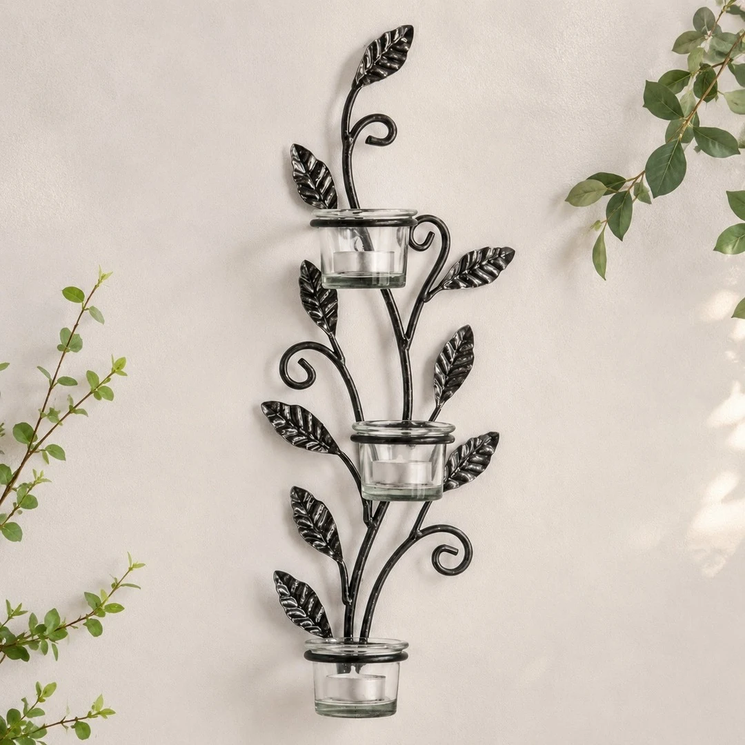 Aura black iron wall candlestick with leaf and vine details