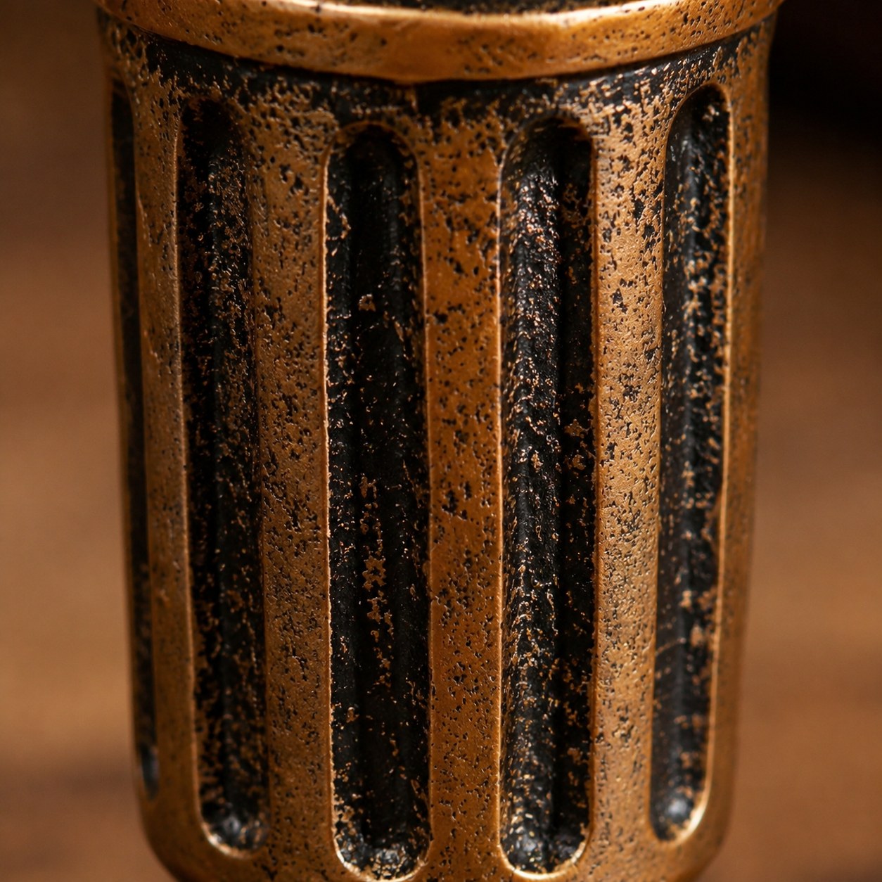 Close detail of Aura candlestick ribbed column and dark patina