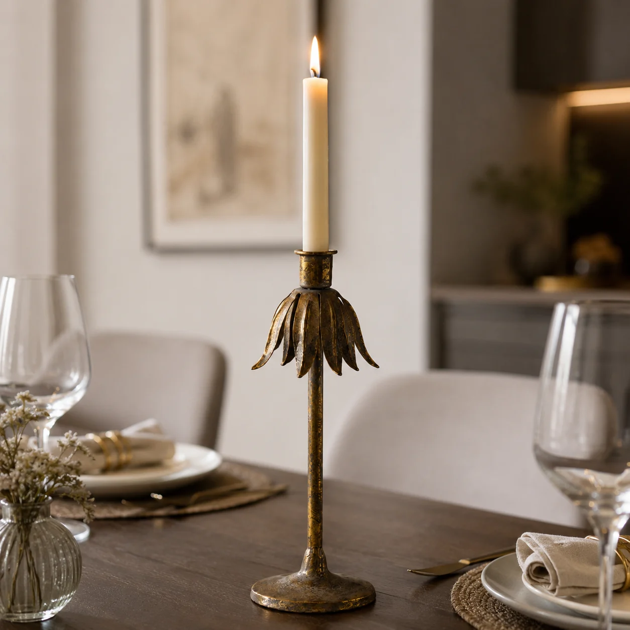 Aura antique metal candlestick styled on a warm tabletop