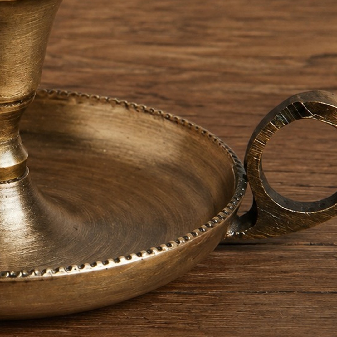 Close-up of Aura candlestick cup, tray rim, and handle