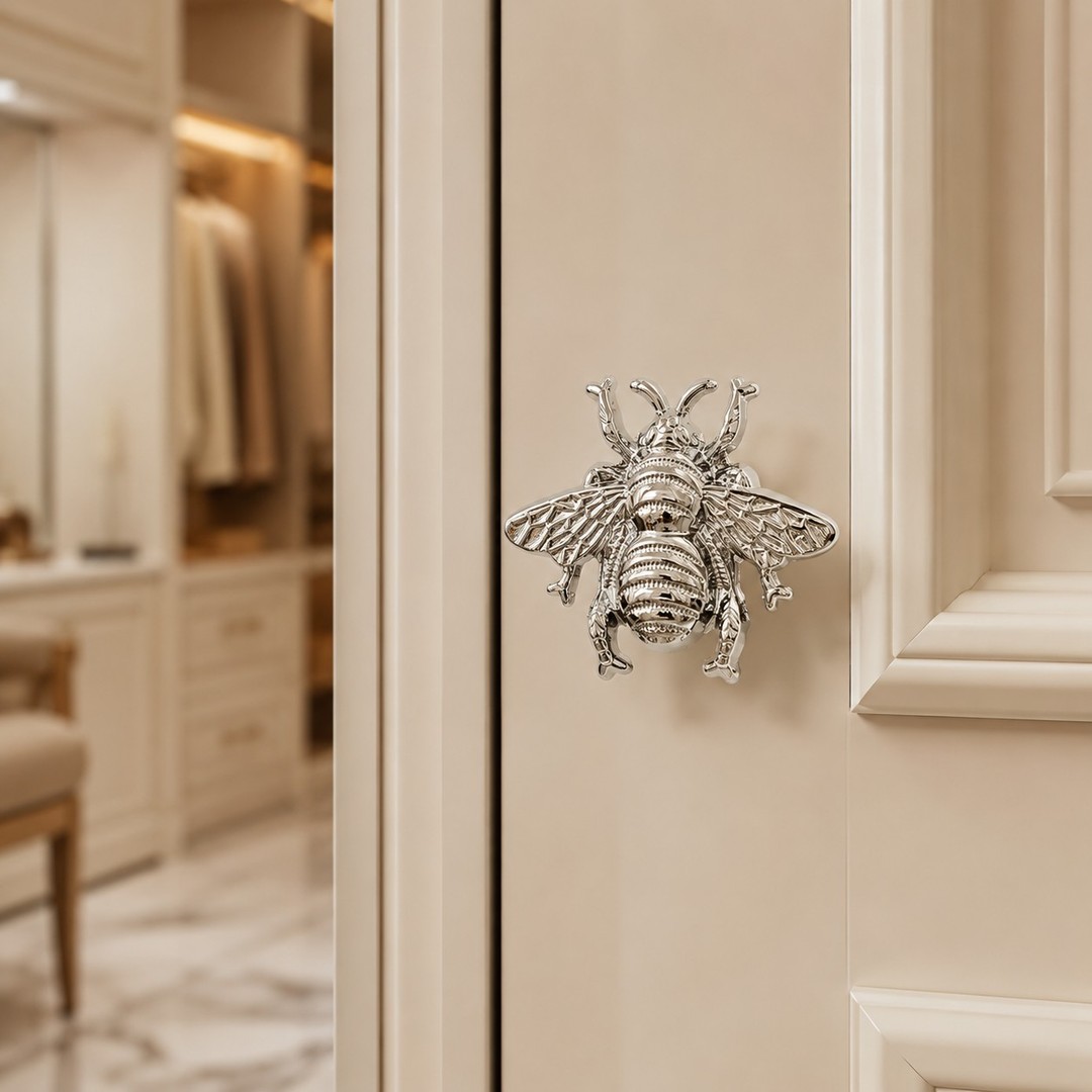 Chrome Totem bee cabinet handle on a cream wardrobe door