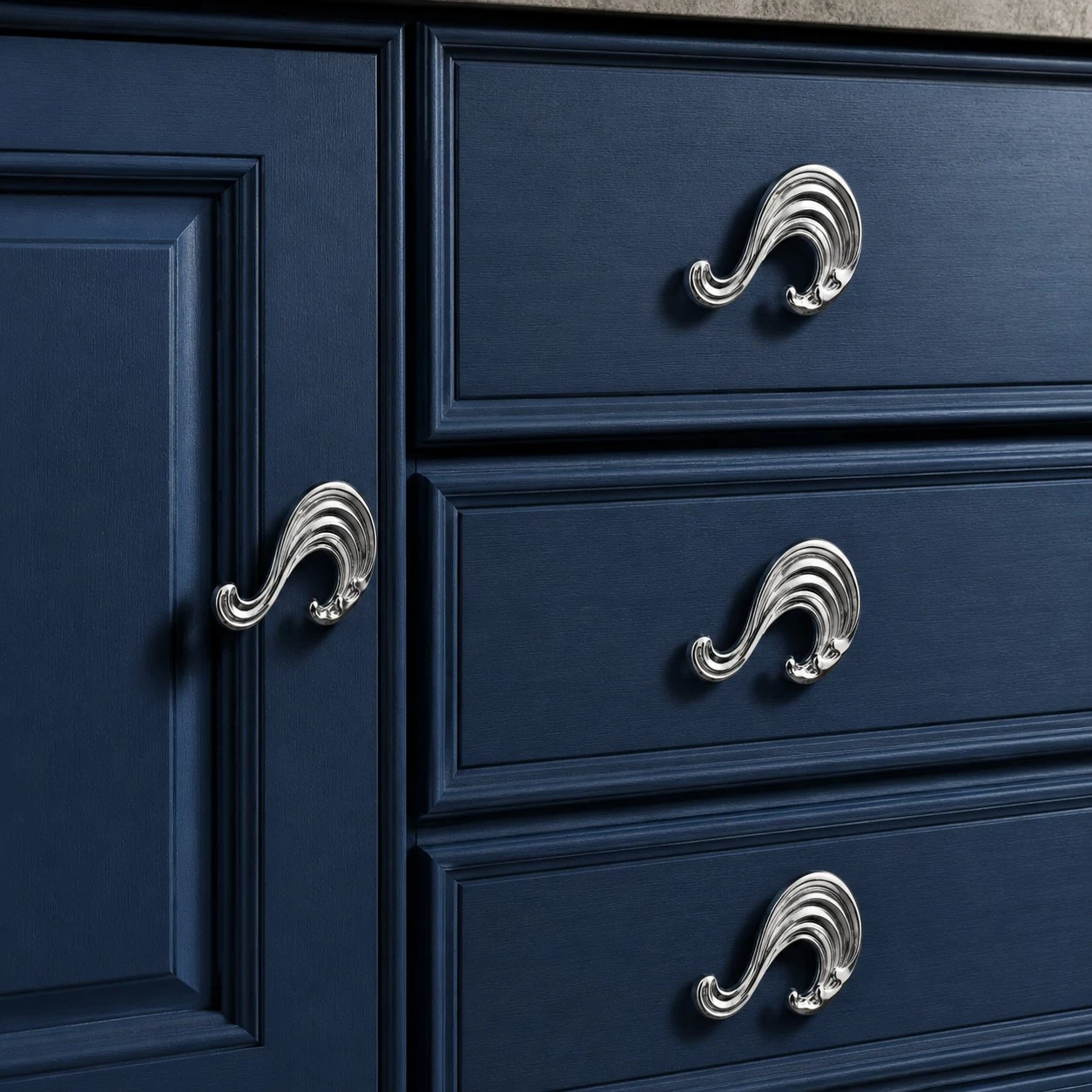 Chrome Wave handles on blue drawers