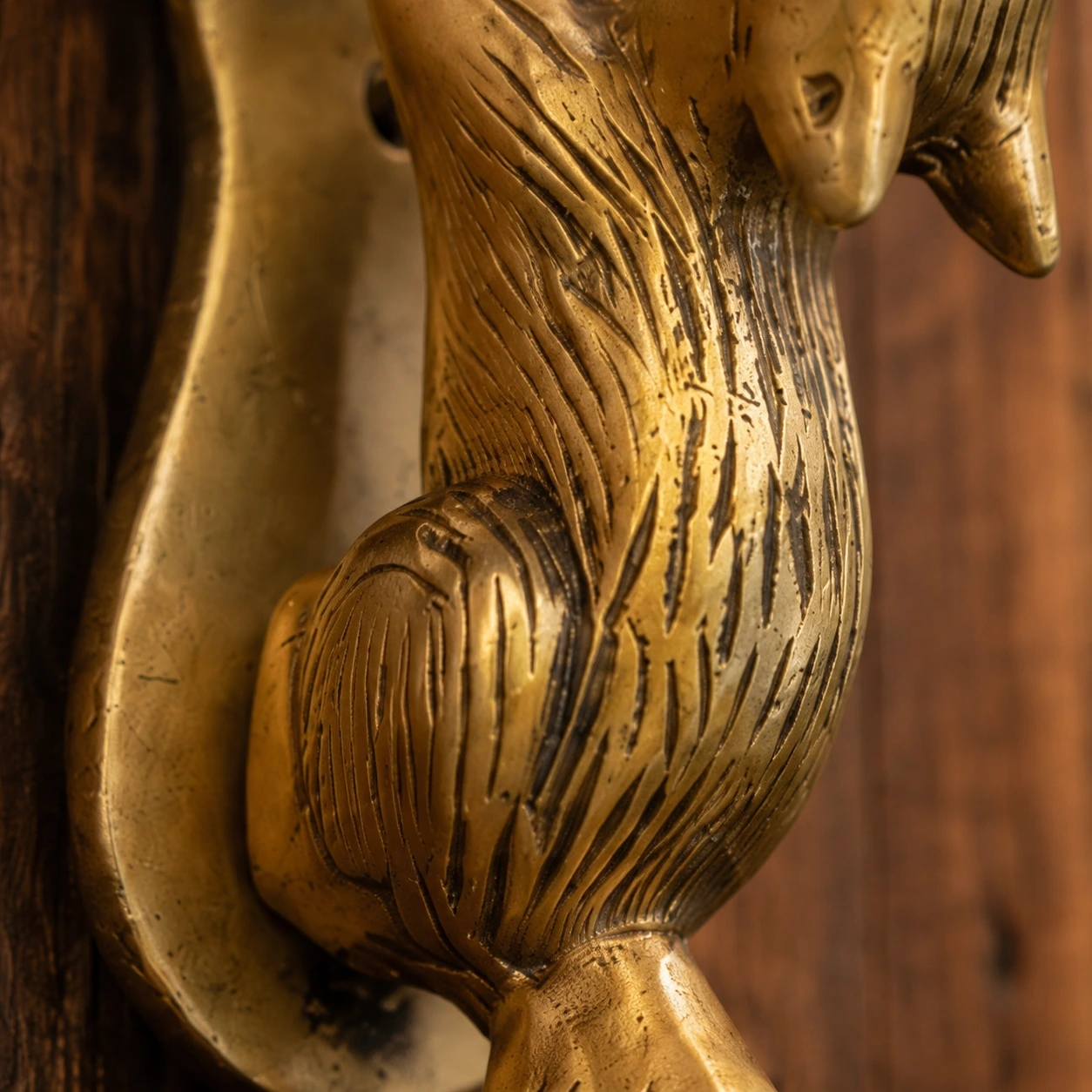 Macro detail of engraved fur texture and aged brass patina